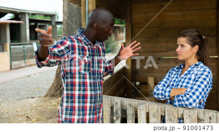 Angry woman quarreling with her afro-american male neighbor 91001473