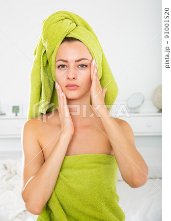 Female touching her face skin 91001520