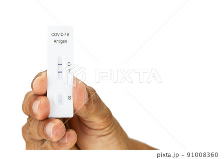 Hand showing Covid-19 self antigen rapid test kit with positive result on white background with clipping path Hand showing Covid-19 self antigen rapid test kit with positive result on white background with clipping path 91008360