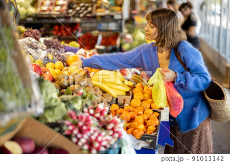 Woman shopping food at market Woman shopping food at market 91013142