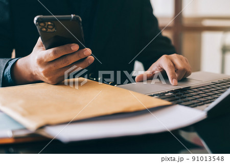 Hand using smartphone payments online shopping,  channel docking keyboard computer. 91013548