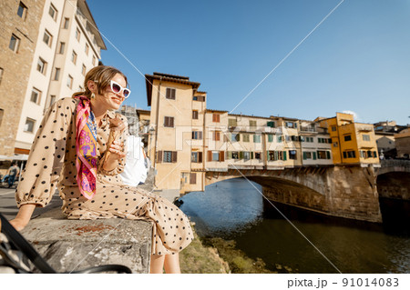 Woman with italian ice cream in Florence, Italy Woman with italian ice cream in Florence, Italy 91014083
