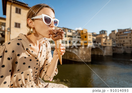 Woman with italian ice cream in Florence, Italy Woman with italian ice cream in Florence, Italy 91014093