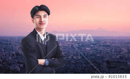 Confidence businessman portrait pink city of Tokyo and Fuji in Background. 91015633
