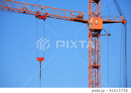 Construction Crane Against Blue Sky 91015758