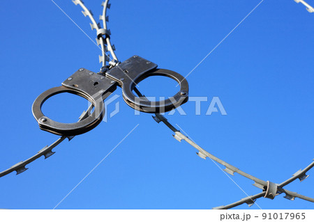 Old Handcuffs On Razor Wire 91017965