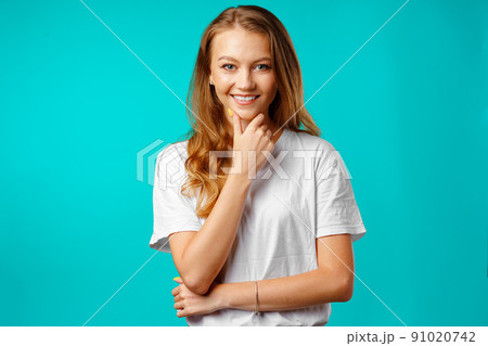 Portrait of a young beautiful happy woman smiling 91020742