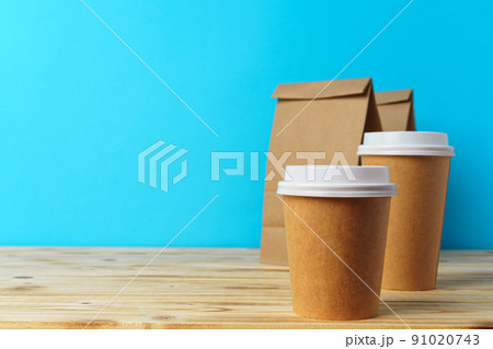 Paper bags with take away food and coffee cups containers Paper bags with take away food and coffee cups containers 91020743