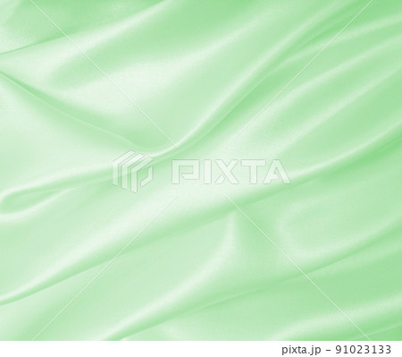 Smooth elegant green silk or satin luxury cloth texture as abstract background. Luxurious background design 91023133