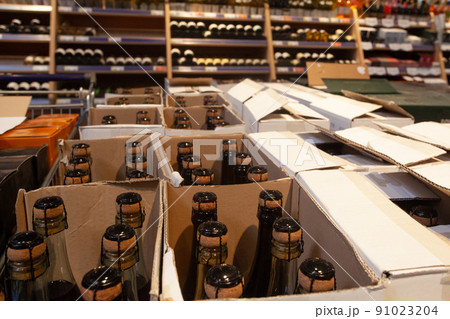 Wine shop. Sparkling wine bottles in boxes Wine shop. Sparkling wine bottles in boxes 91023204