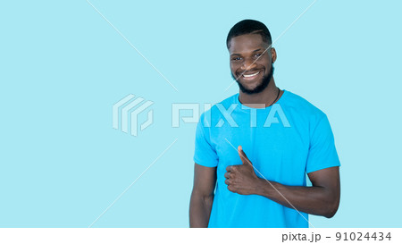 Thumbs up. Agreement sign. Offer advertising. Happy satisfied man showing like approval hand gesture on blue copy space banner background. 91024434
