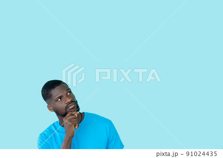 Curious man. Advertising banner. Special offer. Best deal. Interested thoughtful guy considering sale idea isolated on blue empty space background. 91024435