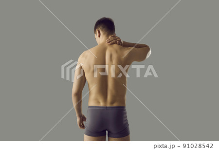 Naked man in underwear suffer from neck ache 91028542