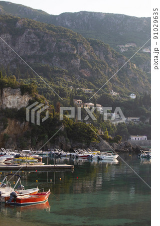 boats in the bay of Paleokastritsa at dawn 91029635