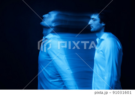 blurred silhouette of ghost man's soul on a dark background 91031601
