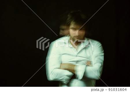 schizophrenic portrait of a psychopathic man with mental disorders in a white shirt 91031604