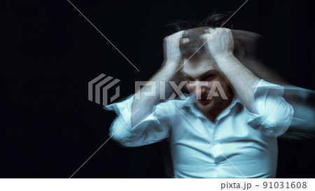 schizophrenic portrait of a psychopathic man with mental disorders in a white shirt 91031608