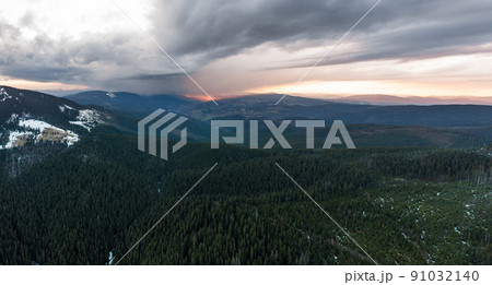 Cloudy skies over the mountains, rainy spring clouds over the forest and mountain tops. Cloudy skies over the mountains, rainy spring clouds over the forest and mountain tops. 91032140