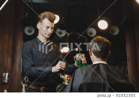 Man work with hair. Hairdresser with a client. 91032305