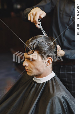 Man work with hair. Hairdresser with a client. Man work with hair. Hairdresser with a client. 91032367