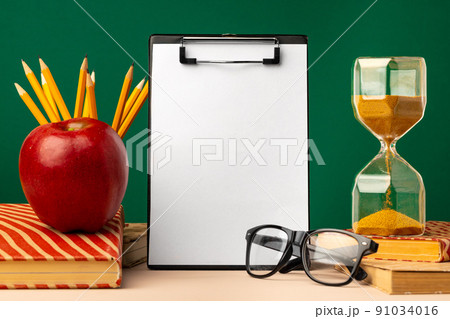 Blank clipboard with copy space and school supplies 91034016