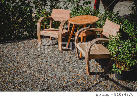 vintage wooden Chairs on backyard tropical garden 91034276