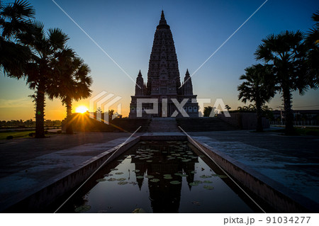 Wat-Panyanantaram or Mahabodhi Temple Bodh Gaya Pagoda in Thailand at sunset culture religion architecture Wat-Panyanantaram or Mahabodhi Temple Bodh Gaya Pagoda in Thailand at sunset culture religion architecture 91034277