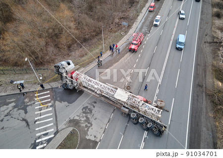 Aerial view of road accident with overturned truck blocking traffic 91034701