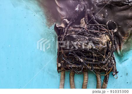 Electrical fire after short circuit in consumer unit, burnt wiring and circuit breakers in switchboard. 91035300