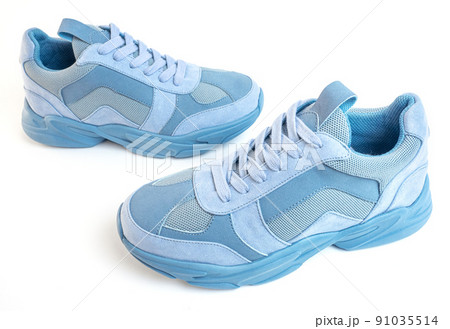 Light blue sneakers on a white background. Sports shoes 91035514