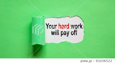 The text 'your hard work will pay off' appearing behind torn green paper. Beautiful background, copy space. The text 'your hard work will pay off' appearing behind torn green paper. Beautiful background, copy space. 91036522