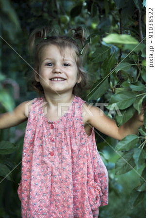 little girl at the garden little girl at the garden 91038522