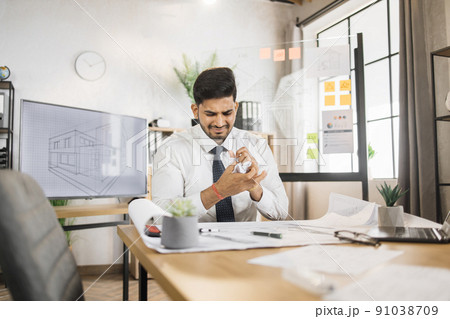Arab enraged architect man or male builder crumpled a piece of paper with an unsuccessful sketches Arab enraged architect man or male builder crumpled a piece of paper with an unsuccessful sketches 91038709