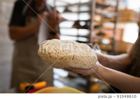 Wholemeal bread dough after fermentation and fermentation. The process of making bread. Front view. 91048610