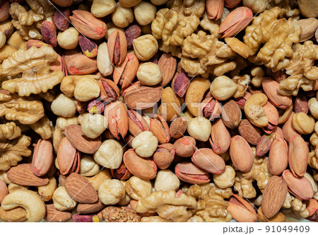 A mixture of peeled nuts for food as a background texture A mixture of peeled nuts for food as a background texture 91049409