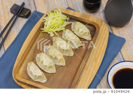 Steamed Gyoza or Chiness water steam dumpling tasty Asian traditional food appetiser. Steamed Gyoza or Chiness water steam dumpling tasty Asian traditional food appetiser. 91049426