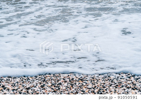 Abstract nature summer or spring ocean sea background. Small waves on golden warm water surface in motion blur with bokeh lights from sunset. Holiday, vacation and recreational background concept Abstract nature summer or spring ocean sea background. Small waves on golden warm water surface in motion blur with bokeh lights from sunset. Holiday, vacation and recreational background concept 91050591