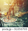 hand Chef preparing spread cheese on pizza on marble table 91050705