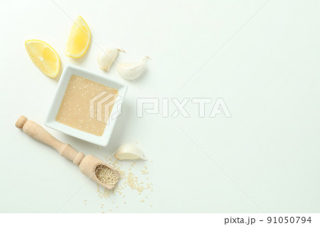 Concept of tasty food with tahini sauce on white background 91050794