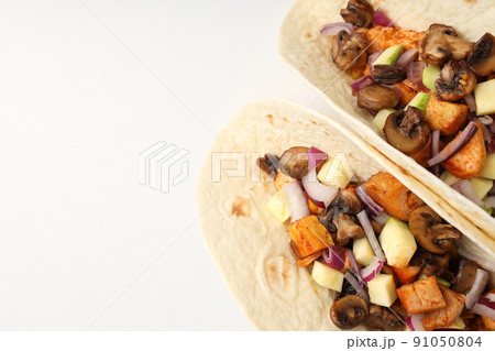 Concept of tasty food with taco on white background 91050804