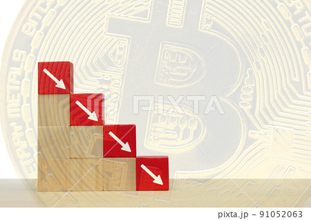 Arrow pointing down on red wooden block. Symbol of the fall of Bitcoin and cryptocurrency on abstract background Arrow pointing down on red wooden block. Symbol of the fall of Bitcoin and cryptocurrency on abstract background 91052063