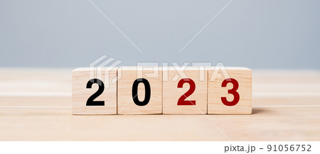 wooden cube block with 2023 text on table background. Resolution, plan, review, goal, start and New Year holiday concepts wooden cube block with 2023 text on table background. Resolution, plan, review, goal, start and New Year holiday concepts 91056752