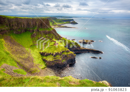 The Amphitheatre, Port Reostan Bay and Giant's Causeway on background, County Antrim, Northern Ireland, UK 91063823