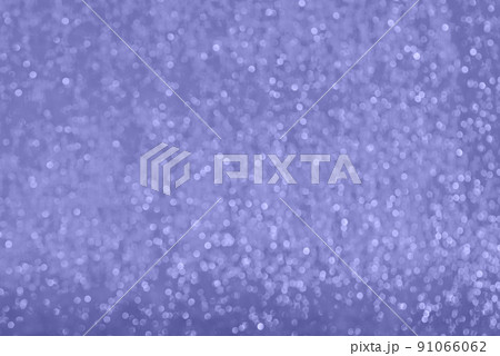 Close-up surface of wrapping film with bokeh effect toned in very peri color 91066062