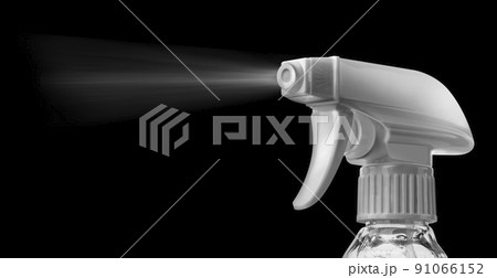 Close view of a plastic spray bottle's head for dispersion isolated on a black background 91066152