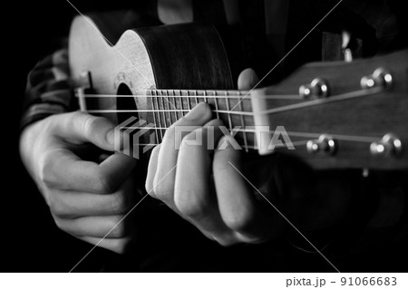 Close up of man hand playing ukulele guitar 91066683