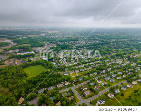American small town with houses and roads on aerial view landscape in New Jersey USA 91069457