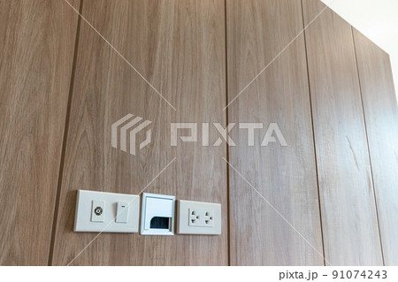 Power outlet on wooden Wall Background 91074243