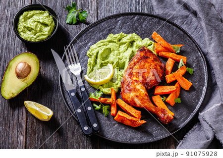 chicken with guasacaca sauce and sweet potato 91075928