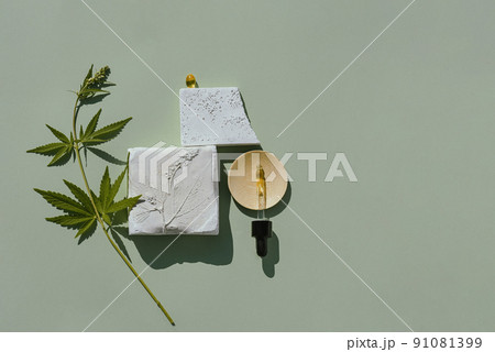 Podium and hemp leaf for the presentation of products with CBD oil and cannabis 91081399